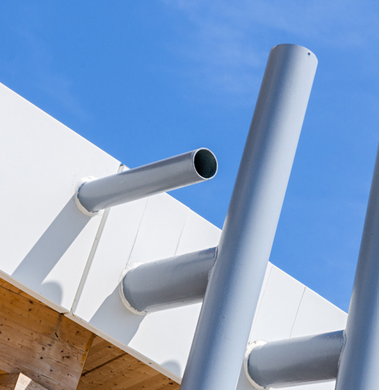 A detail shot of external architectural pipes on the facade of Scarborough Civic Centre Branch Library.