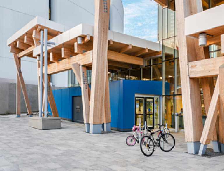 The entrance of the Scarborough Civic Centre Branch Library with bikes in front of it.