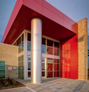 The main entrance of the Garry W. Morden Centre with its red exterior coverings.