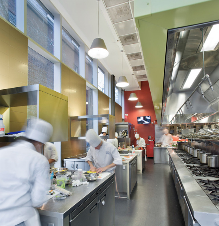 Chefs at work in the kitchen of the George Brown Culinary School.