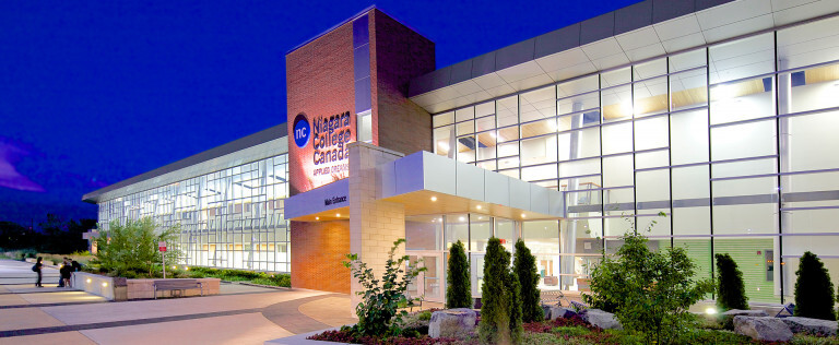 The lighted exterior of the Niagara College - AHI.
