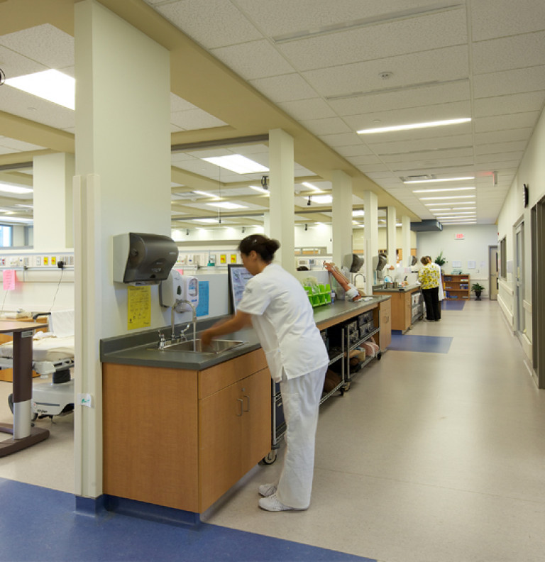 A student of the Niagara College - AHI washes her hands within the facility.