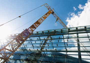 A crane on a construction site - design-build service.