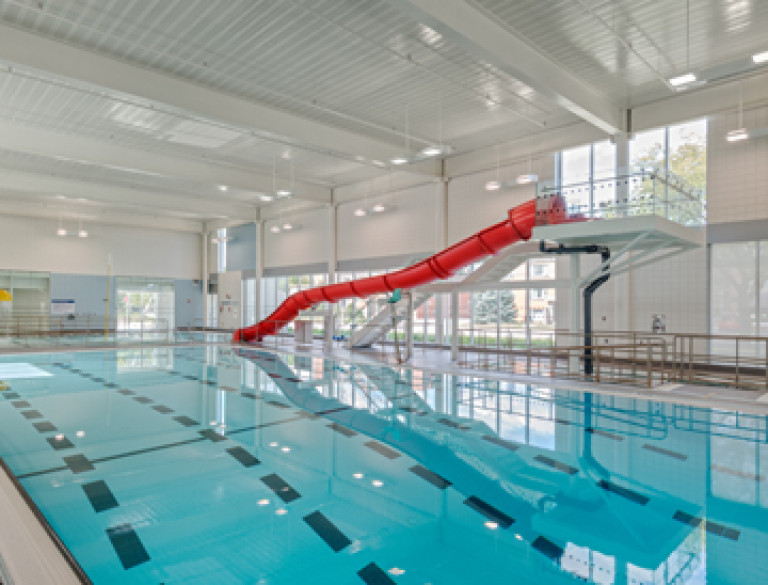 The indoor swimming pool with red slide of the Stoney Creek Community Centre.