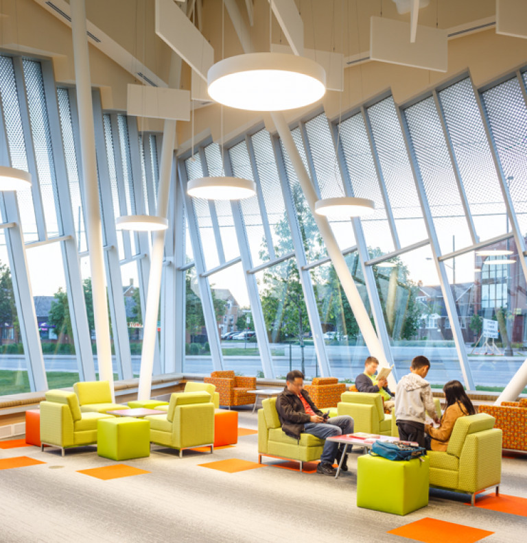 The lounge area of the Vaughan Civic Centre and Resource Library with green and orange chairs.