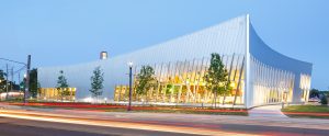A panorama shot of the lighted Vaughan Civic Centre and Resource Library at dusk.