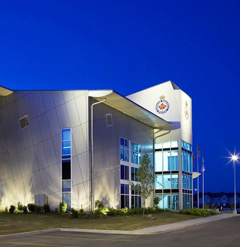 The exterior of the Whitby Community Police Office at night.