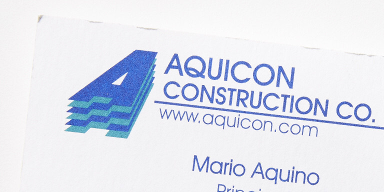 Company business cards from the old days - Aquicon Construction company history.