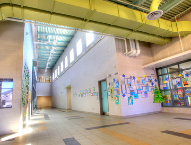 A corridor of the Ardagh Bluffs Public School showing the shaft and pipe system.