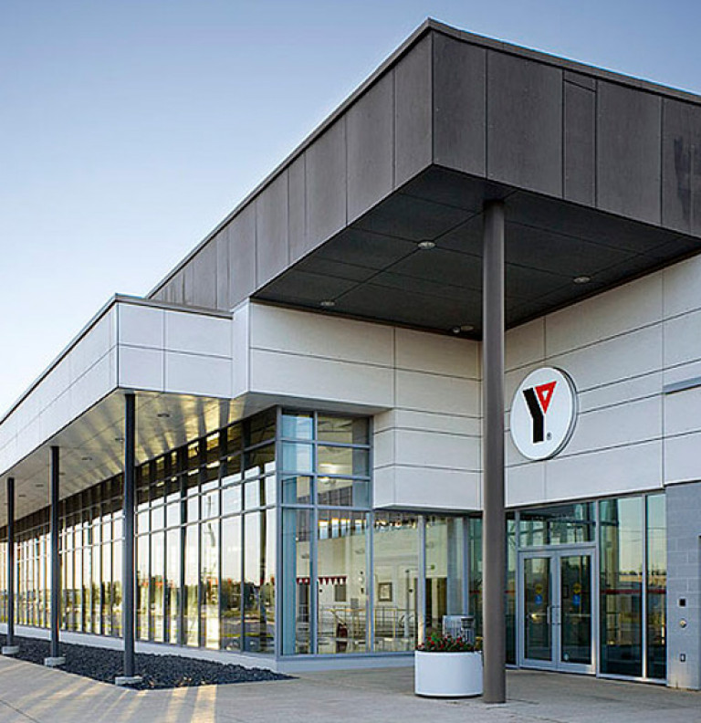 An exterior view of the modern entranceway to the Markham YMCA.