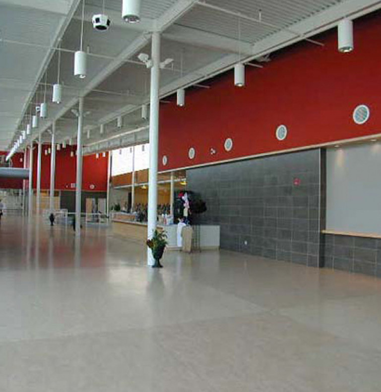 Wide and open communal space defines the walkways of the Peterborough Sports & Wellness Centre.