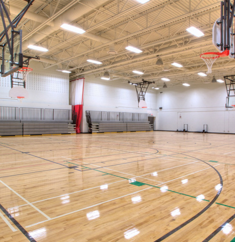View of the large recreational gym space at the Queen Elizabeth Park Community Centre.