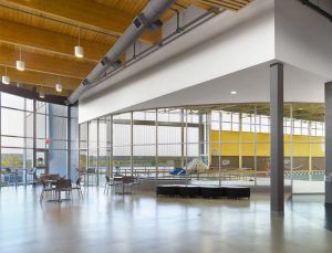 The Quinte West YMCA's interior reflects a modern industrial style.