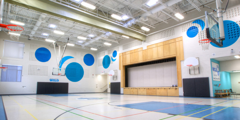 Wide view of the sports hall and auditorium of Whitby Shores Public School.