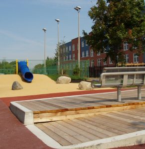 Modern outdoor recreational space at the YWCA New Residential Building & Child Care Centre.